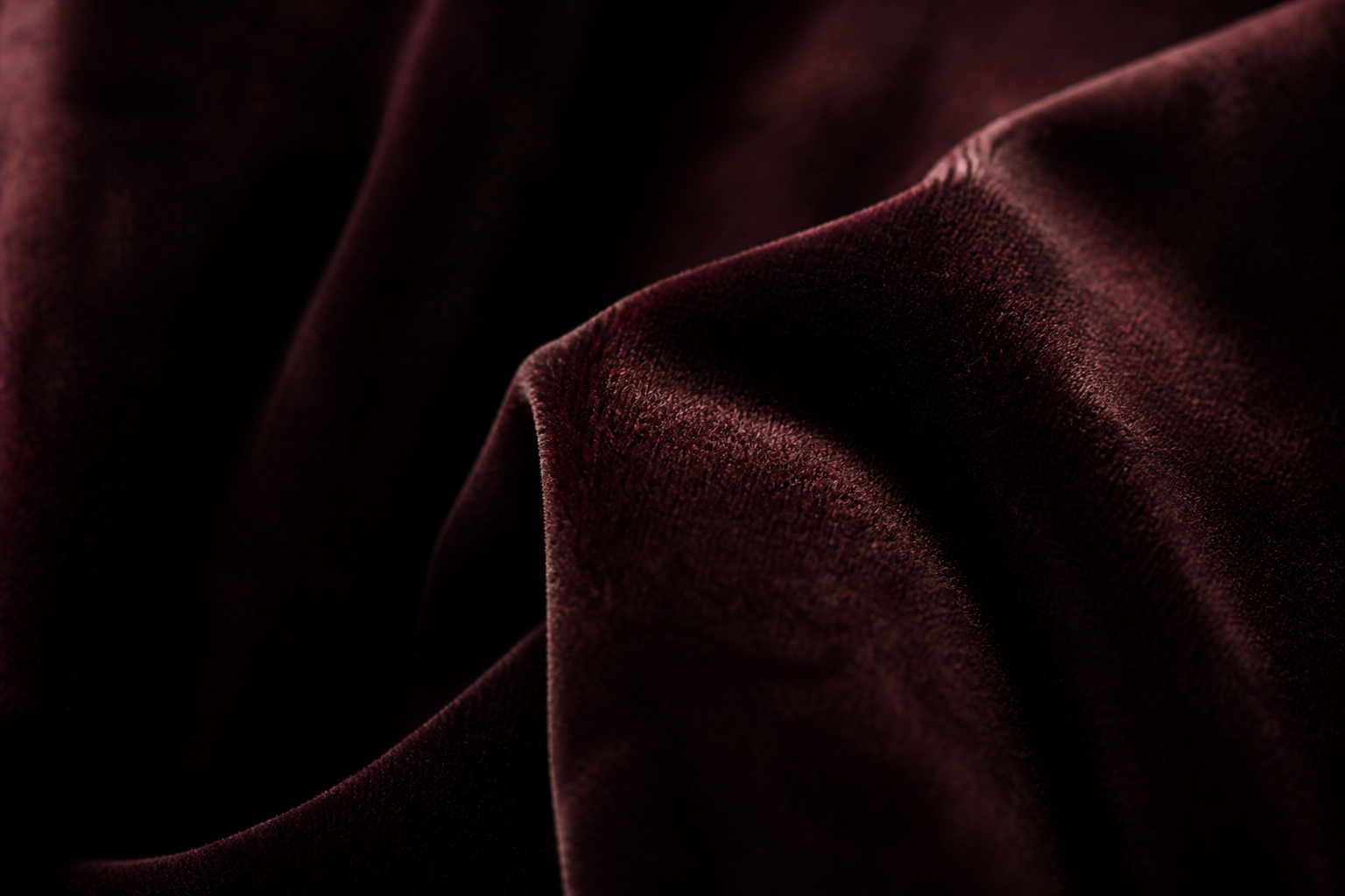 Dark velvet fabric folds